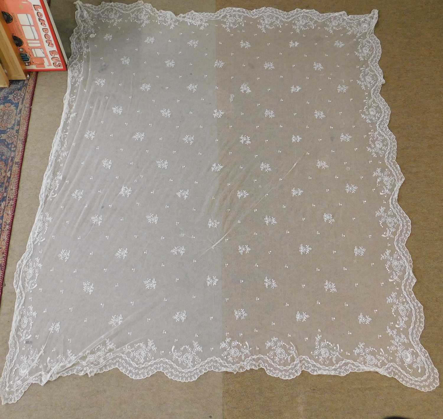 A late Victorian lace veil/shawl, with scalloped edges and floral detail throughout, approx. 163 x