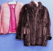 A lady's faux fur coat and pink boulce jacket, the brown faux fur coat by Zepla with black and