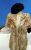 A tailored fur wrap together with three fur hats and a sheepskin scarf (5)