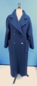 A lady's navy blue wool coat by Aquascutum, double breasted with front patch pockets, check