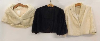 A ladies cream fur bolero style jacket, together with a cream fur short cape and a brown fur