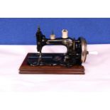 A late 19th century hand turned sewing machine