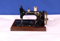 A late 19th century hand turned sewing machine