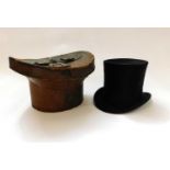 A black silk top hat by Herbert Johnson, 38 New Bond Street, London, inner diameter approx. 54cm, in