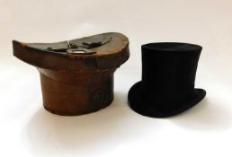 A black silk top hat by Herbert Johnson, 38 New Bond Street, London, inner diameter approx. 54cm, in