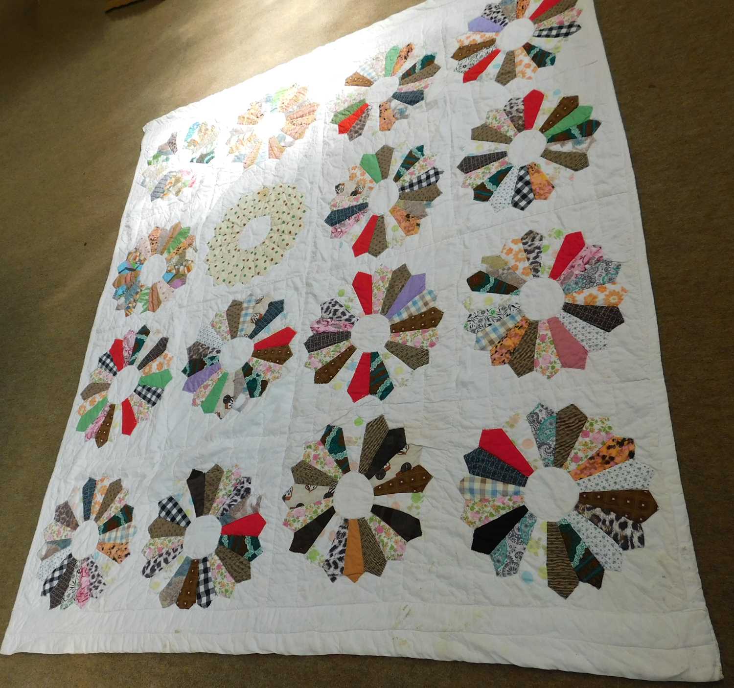 A patchwork quilt, with cream ground and multi colour patchwork design, approx. 168 x 190cm