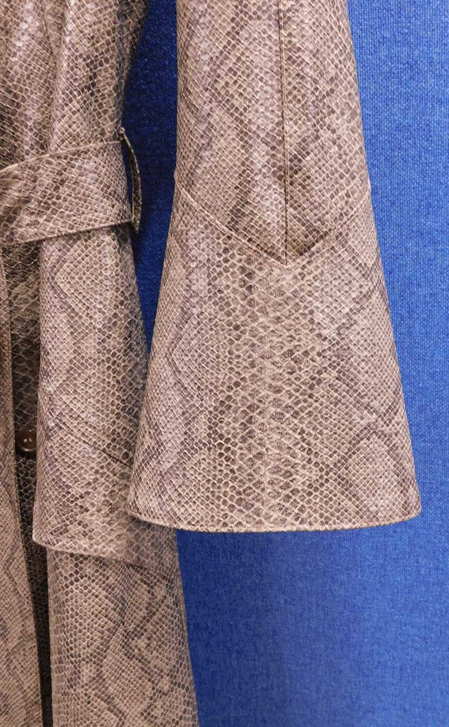 A c.1960's faux snakeskin trenchcoat by Donatella Boutique, France, single breasted with bell - Image 3 of 5