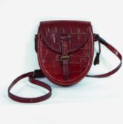 A lady's red Mulberry handbag, the half oval shaped red mock croc leather cross body bag with buckle