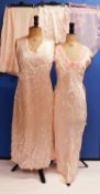 A quantity of mid 20th Century lady's nightwear and lingerie, to include two pink sleeveless satin