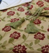 A pair of beige with red and green velour pattern curtains, lined, each approx. 223cm wide by