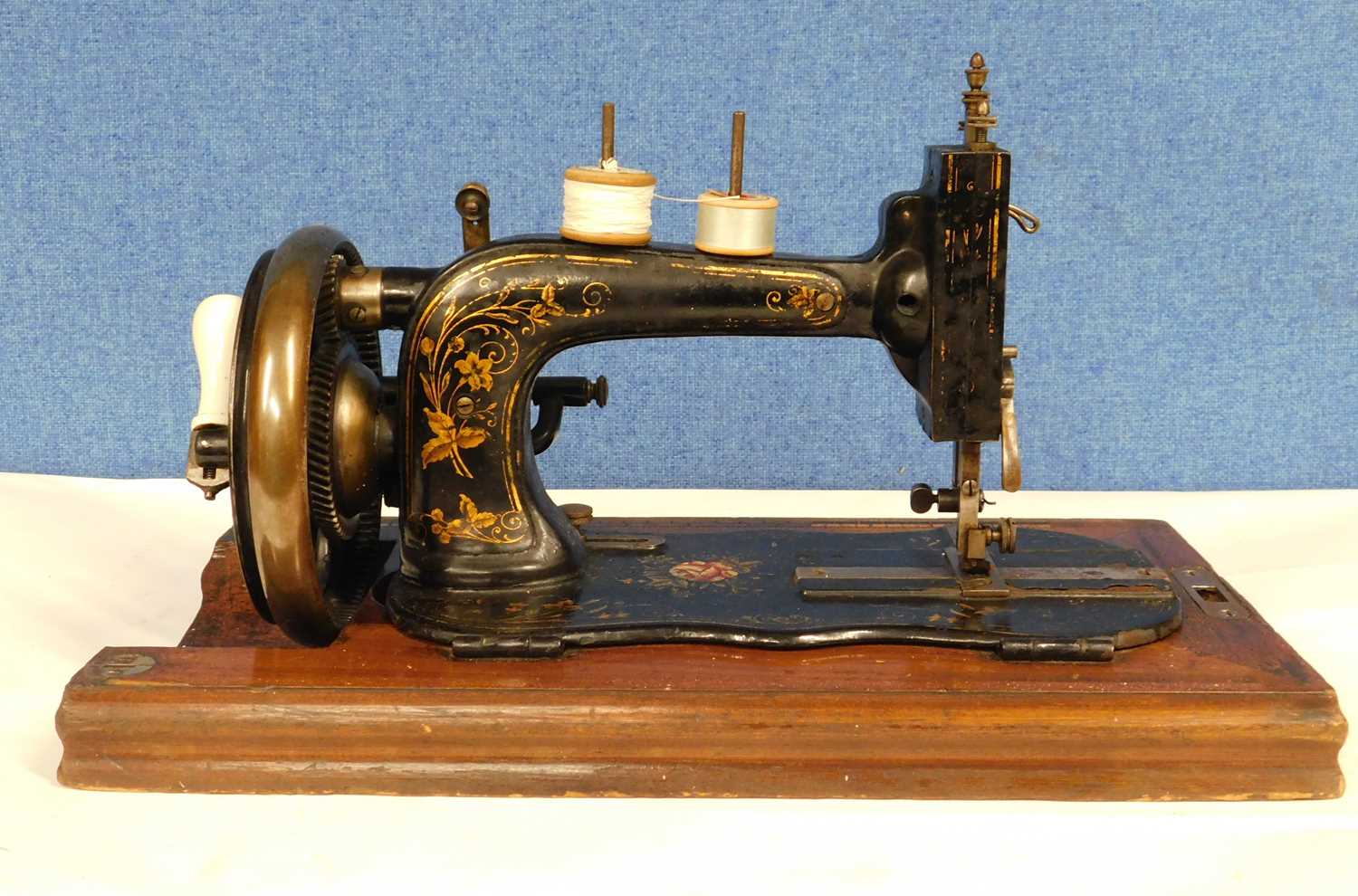 A late 19th century sewing machine, possibly German, with original carry case cover - Image 4 of 7