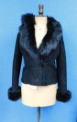 A lady's black suede and sheepskin jacket by Artigiano, single breasted with turn-up cuffs and fur