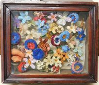 A selction of wirework framed needlework and woolwork flowers, in varying colours and sizes, in