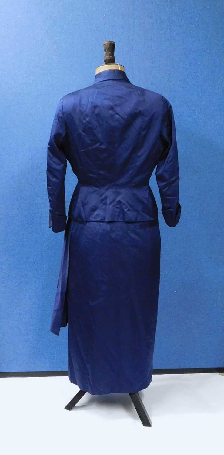A navy blue satin dress and matching jacket by Hardy Amies, 14 Saville Row, London, W1, the capped - Image 2 of 12