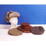 Four hats to include a tan leather hat by Toggi, size M, a fur trapper hat by Mountain Horse, one