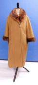 A lady's cashmere and mink coat by Hutzler's, Baltimore, the full length toffee coloured cashmere