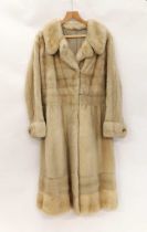 A ladies full length cream fur coat, with broad cuffs with faux pearl detail buttons, broad hem,