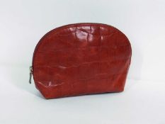 A red Mulberry purse, the red leather mock croc arched top purse, zip closure with Mulberry stamp to