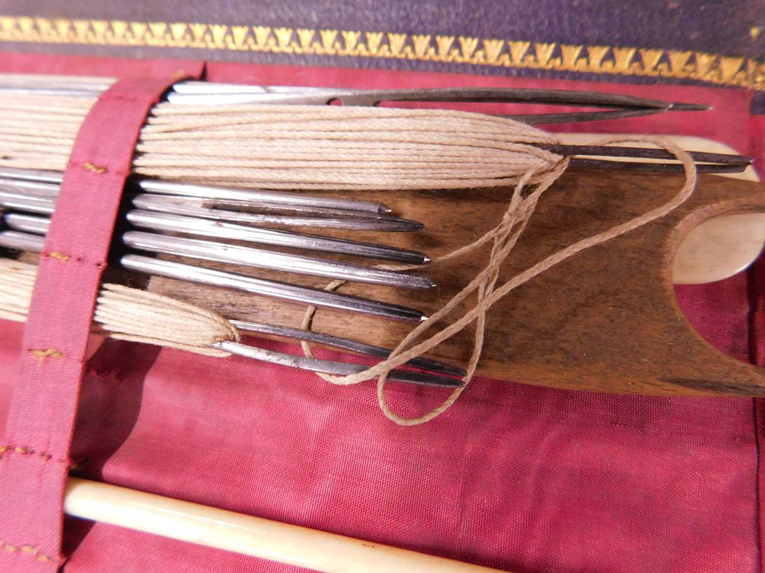 A leather case of various needlework tools, the green leather case with gilt decoration, opening - Image 5 of 10