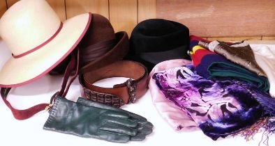 A mixed lot of lady's accessories to include three hats, leather belts, silk scarves, leather gloves
