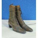 A pair of late 19th/early 20th Century brown leather and suede healed boots with pointed toes,