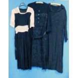 Three mid 20th Century lady's dresses, to include a black and cream short sleeved crepe dress with