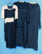 Three mid 20th Century lady's dresses, to include a black and cream short sleeved crepe dress with