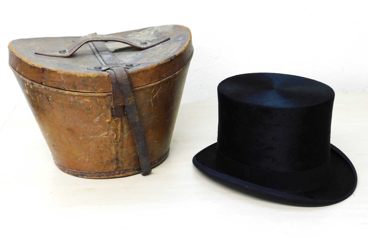 A black silk top hat by Hope Brosthers Ltd., Ludgate Hill, London, inner diameter approx. 55cm, with