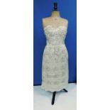 A mid 20th Century strapless beaded cocktail dress with boned corset, lace overlay with beaded