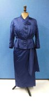 A navy blue satin dress and matching jacket by Hardy Amies, 14 Saville Row, London, W1, the capped