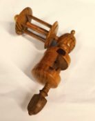 A 19th century fruitwood sewing clamp thread winder, approx. 17 x 14cm
