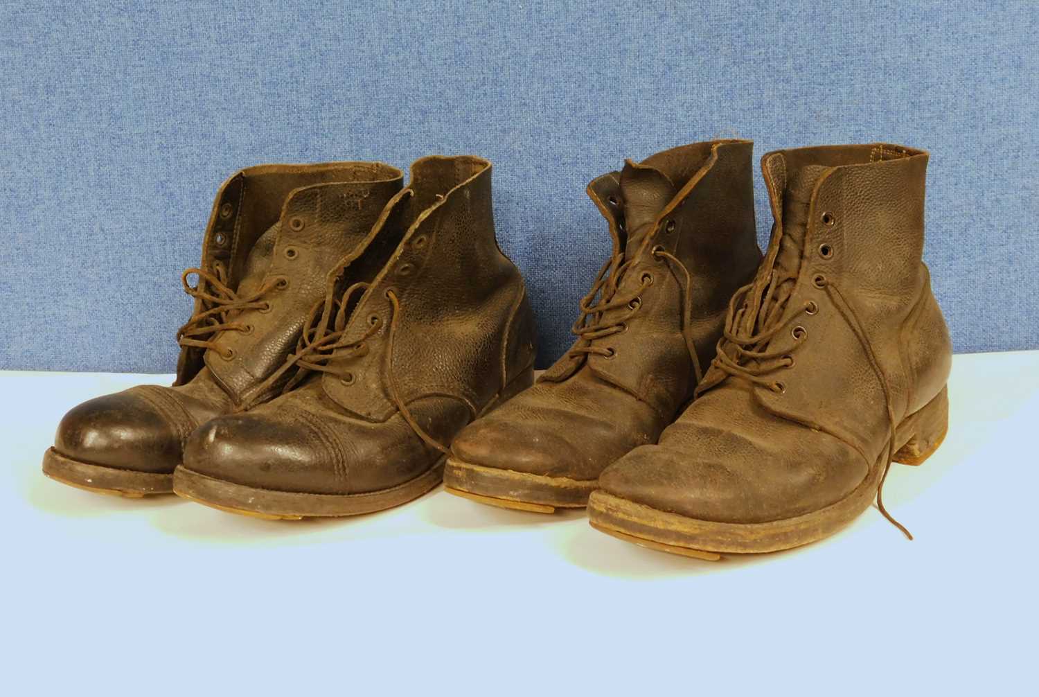 Two pairs of mid 20th Century black leather hobnail boots, one dated 1941, and another pair