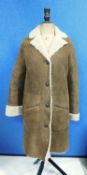 A lady's Belstaff sheepskin three quarter length coat, single breasted with four button fastening,