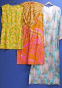Three circa 1960's/70's lady's dresses to include a blue and white floral full length cotton dress