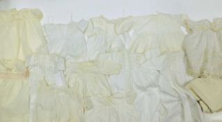 Seven children's christening gowns together with a quantity of white and cream children's wear