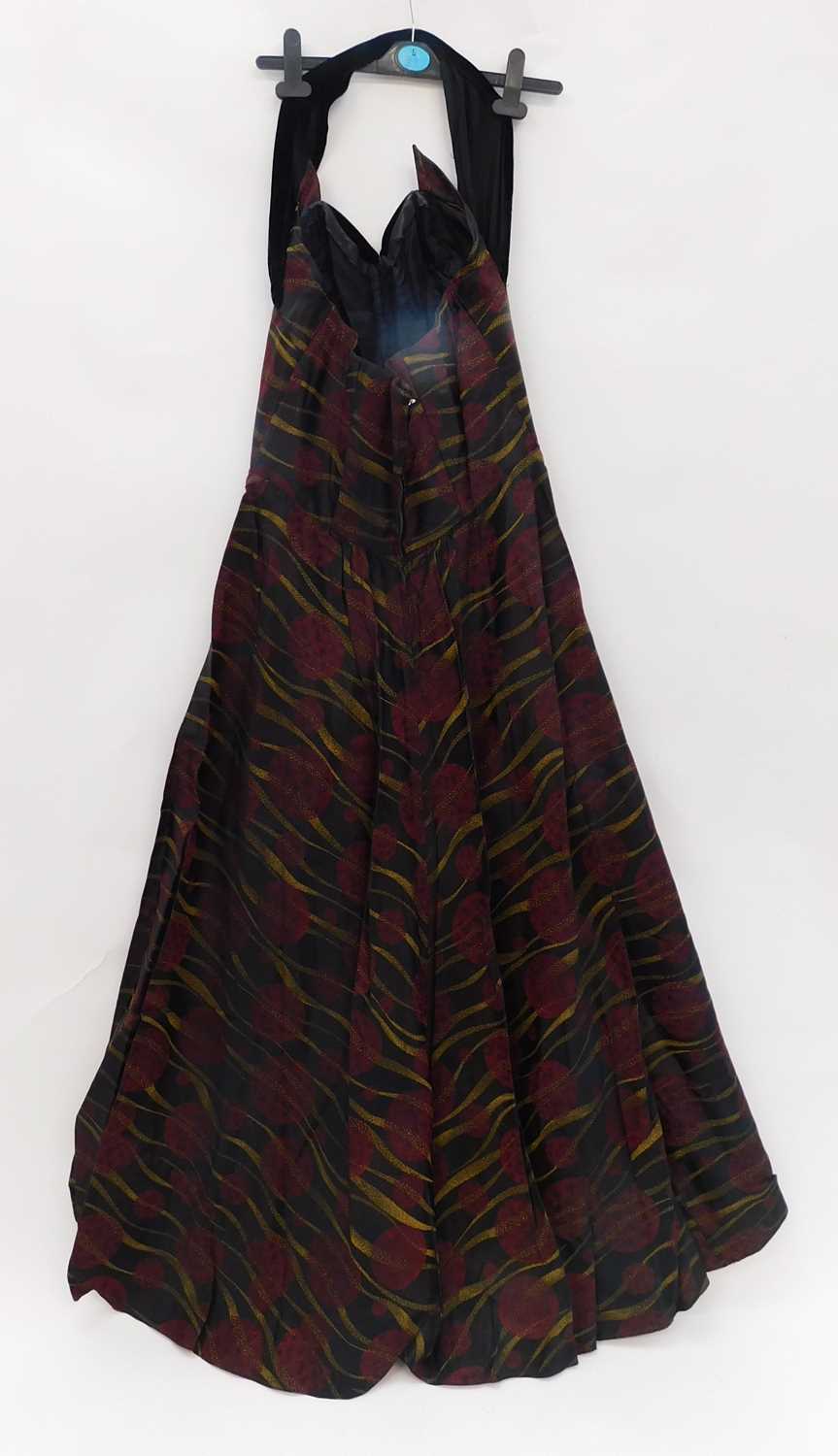 A lady's evening dress by Ricci Michaels of Mayfair, the halterneck dress with black red and gold - Image 3 of 3