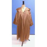 A lady's mid 20th century brown satin swing coat by Hettemarks, Sweden, with broad revere collar