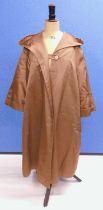 A lady's mid 20th century brown satin swing coat by Hettemarks, Sweden, with broad revere collar