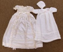 A mid 20th century silk christening gown, the cream silk gown with lace and pintuck decoration,