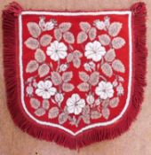 A beaded screen/pennant, the red needlework background with all over beaded flowers and beaded