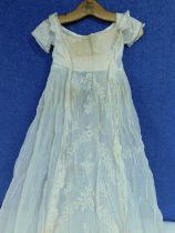 A late 19th/early 20th century christening robe, fine cotton with lace panel to front and cap