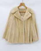 A lady's 'pearl' mink jacket, with single clip fastening and side pockets very slightly stiff some