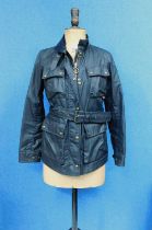 A lady's Belstaff Trailmaster Professional jacket, the navy blue zip front with corduroy collar,