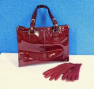 A lady's red patent leather handbag by Jaeger with matching red leather gloves also by Jaeger (2)