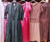A selection of mid 20th Century lady's wear to include a fitted red short sleeved round necked