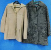 Two sheepskin coats, one in beige sheepskin with duffle buttons and quilted shoulder detail; the