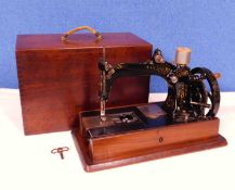 A late 19th century Wheeler & Wilson sewing machine, c.1870's, with original carry case