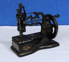 ***PLEASE NOTE AMENDMENT* A late 19th century sewing machine, 'The Globe', P.3115, approx. 36cm wide