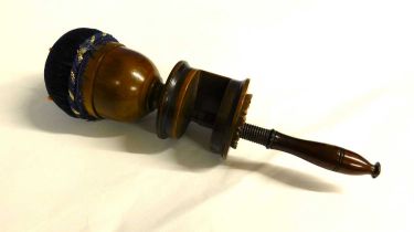 A late 19th century fruitwood sewing clamp with pincushion top, approx. 23cm long