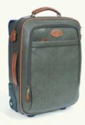 A Mulberry brown and tan leather suitcase, the brown textured leather with tan handles and trim,